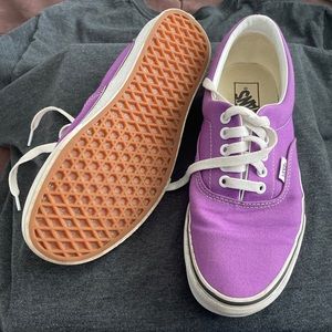 The purple vans are a size 7.5